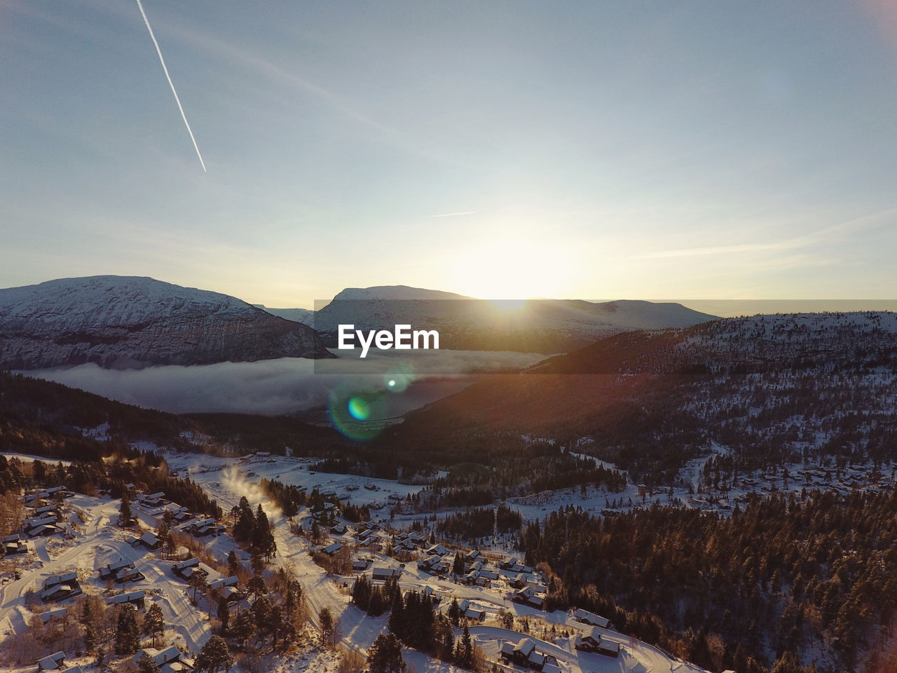 Aerial view of snowcapped mountains against sky