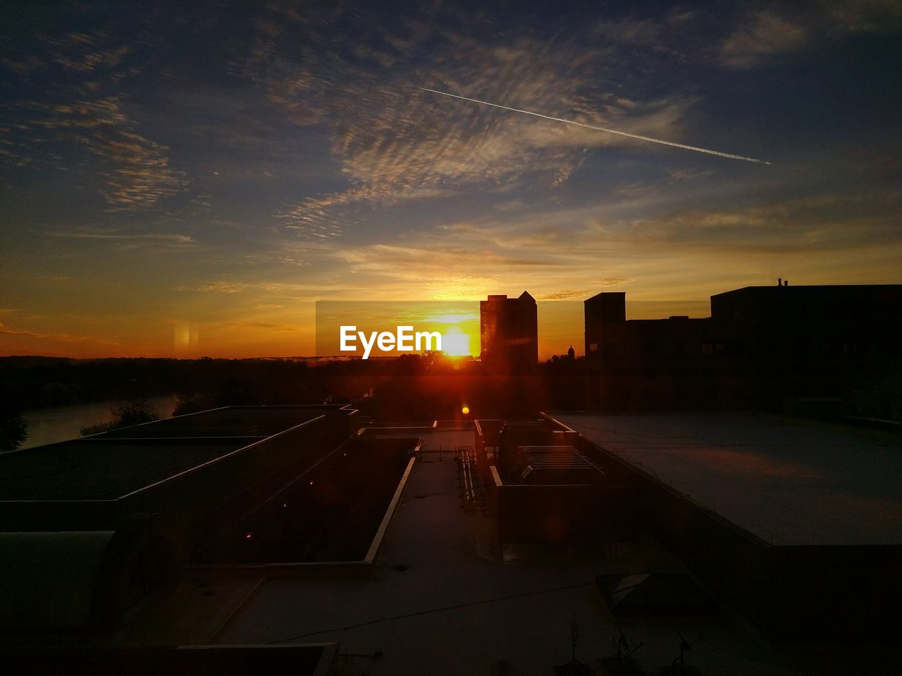 Scenic view of sunset over buildings in city