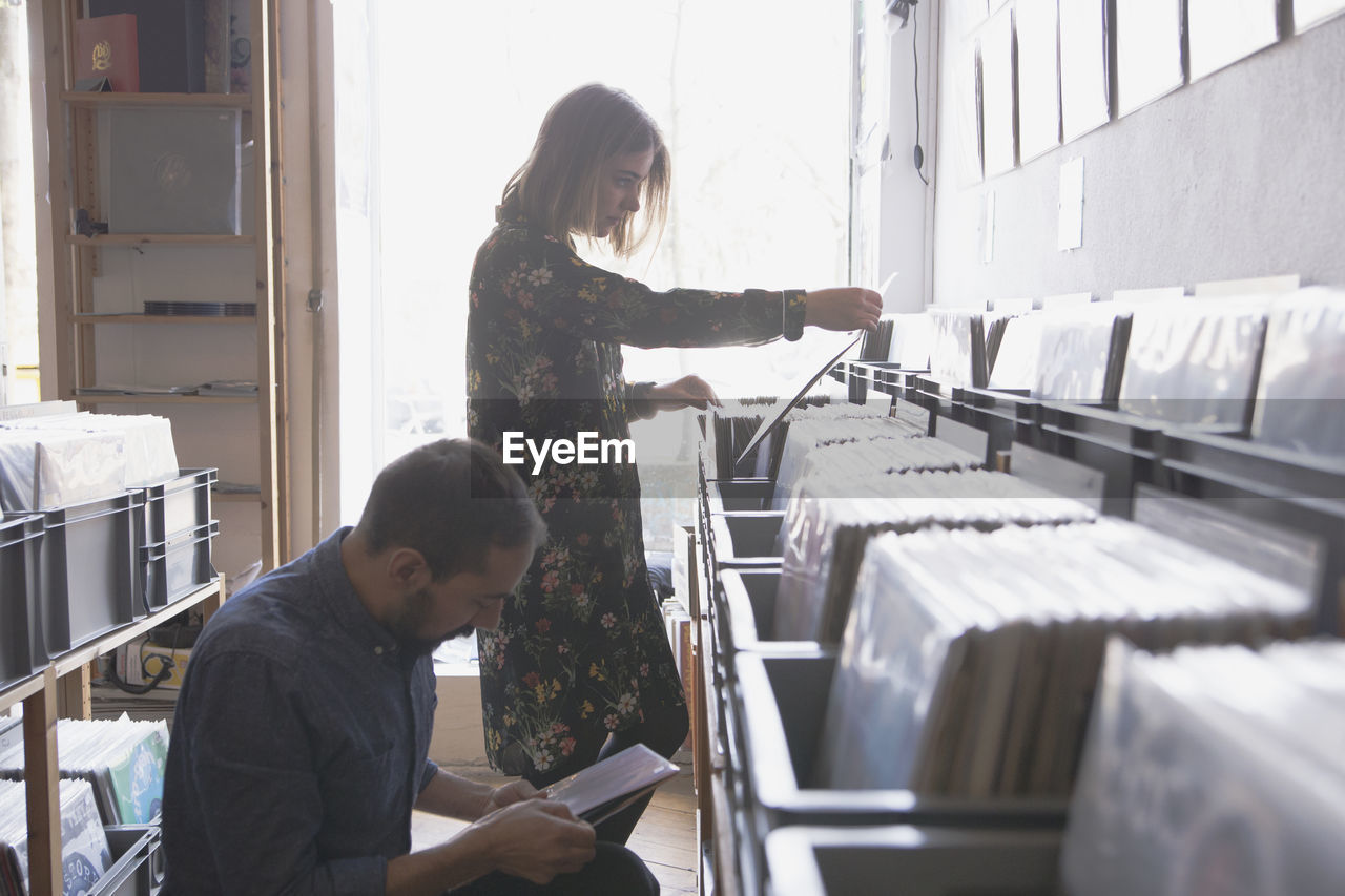 Young couple shopping for records together