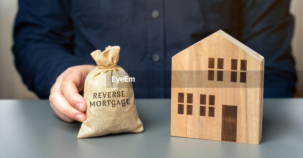 Reverse mortgage concept. allowing homeowners to borrow money by using their home 