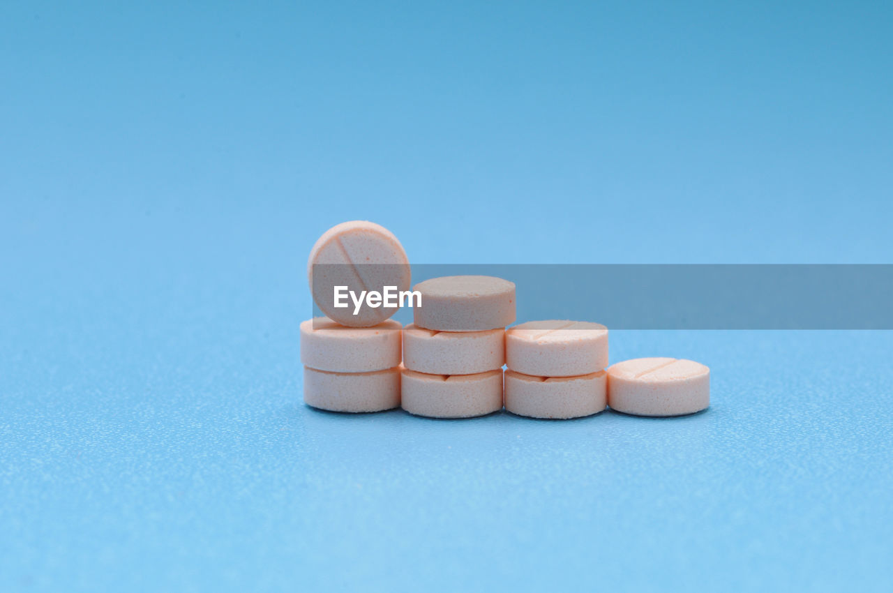 Close-up of pills against blue background