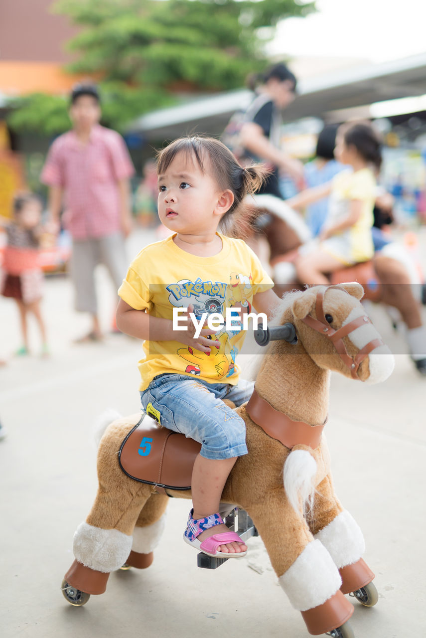 CUTE GIRL PLAYING WITH TOY