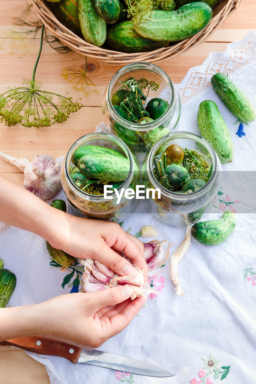 High angle view of hands preparing food