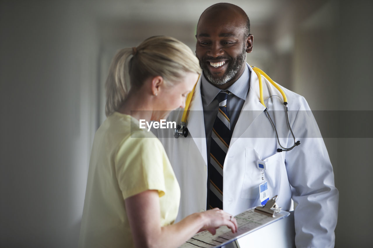 Happy doctor and nurse at hospital