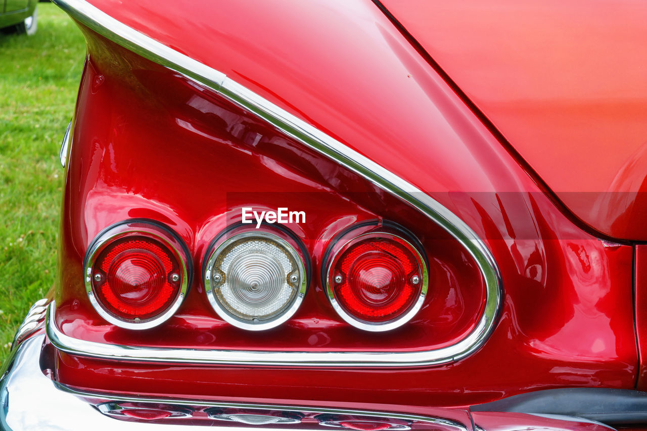 Tail lights and a wing on old classic american car