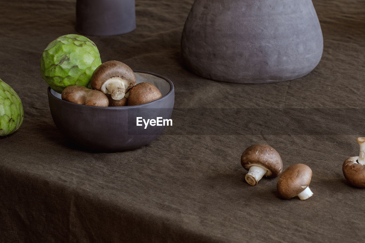 food and drink, food, healthy eating, wellbeing, freshness, vegetable, produce, wood, indoors, still life, table, no people, ingredient, nut, nut - food, studio shot, nuts & seeds, organic, bowl, raw food, fruit, plant, walnut, garlic, mushroom