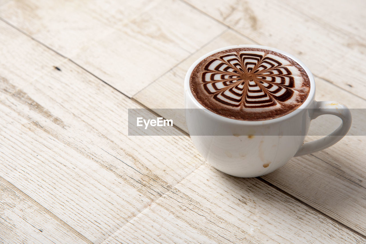 drink, coffee, food and drink, refreshment, mug, cup, coffee cup, wood, hot drink, latte, cappuccino, table, frothy drink, still life, froth art, no people, freshness, crockery, indoors, food, cafe, brown, pattern, close-up, high angle view