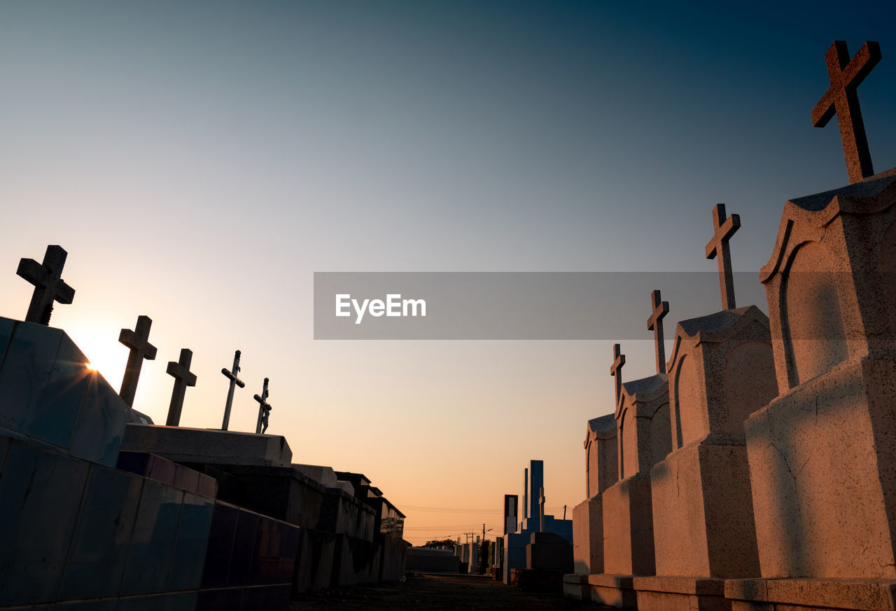 Cemetery or graveyard in the evening with sunset sky. headstone and cross tombstone cemetery. 