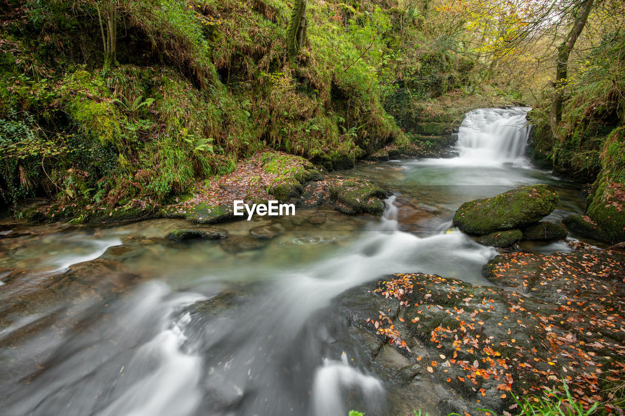 Long exposure of a waterfall on the hoar oak water river at watersmmet in exmoor national park 
