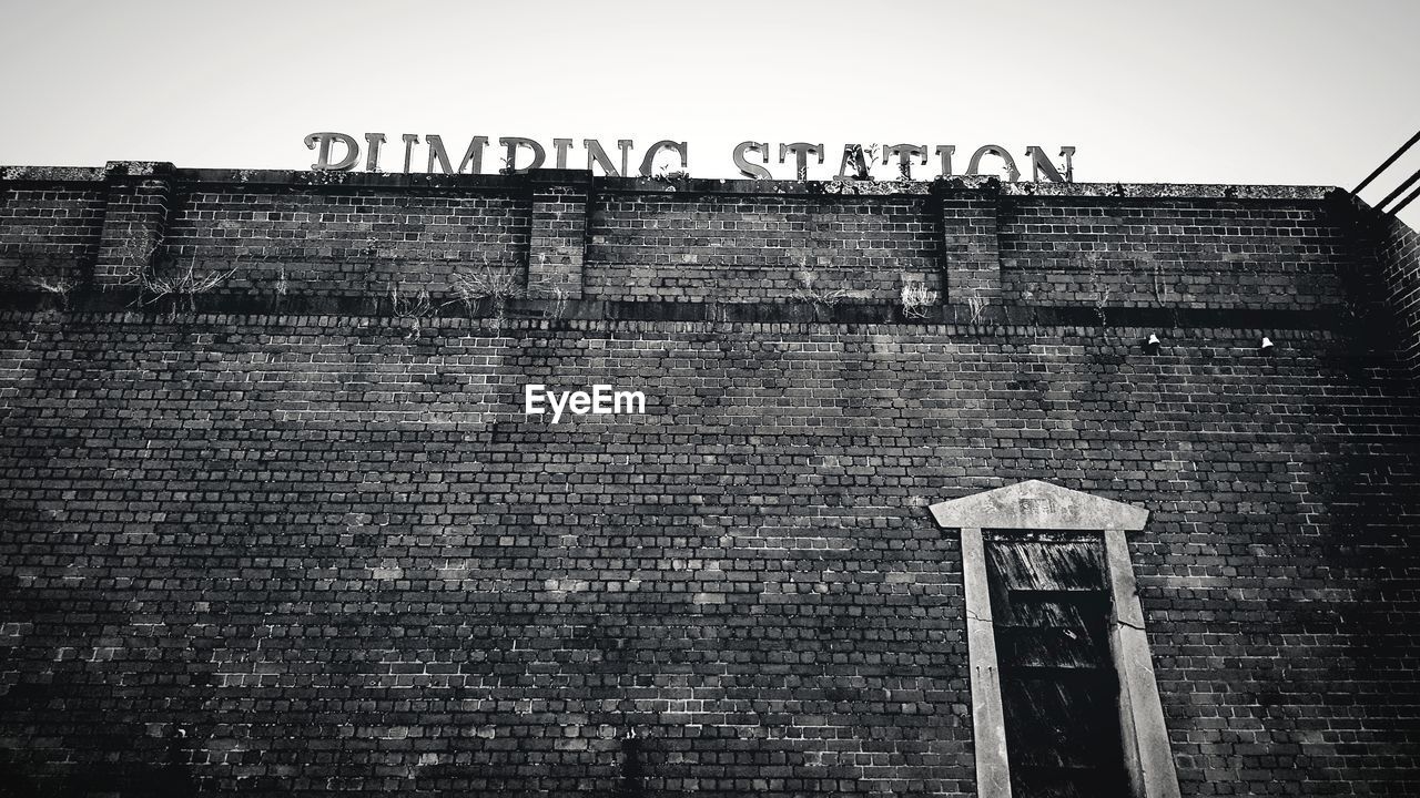 GRAFFITI ON BUILDING AGAINST CLEAR SKY