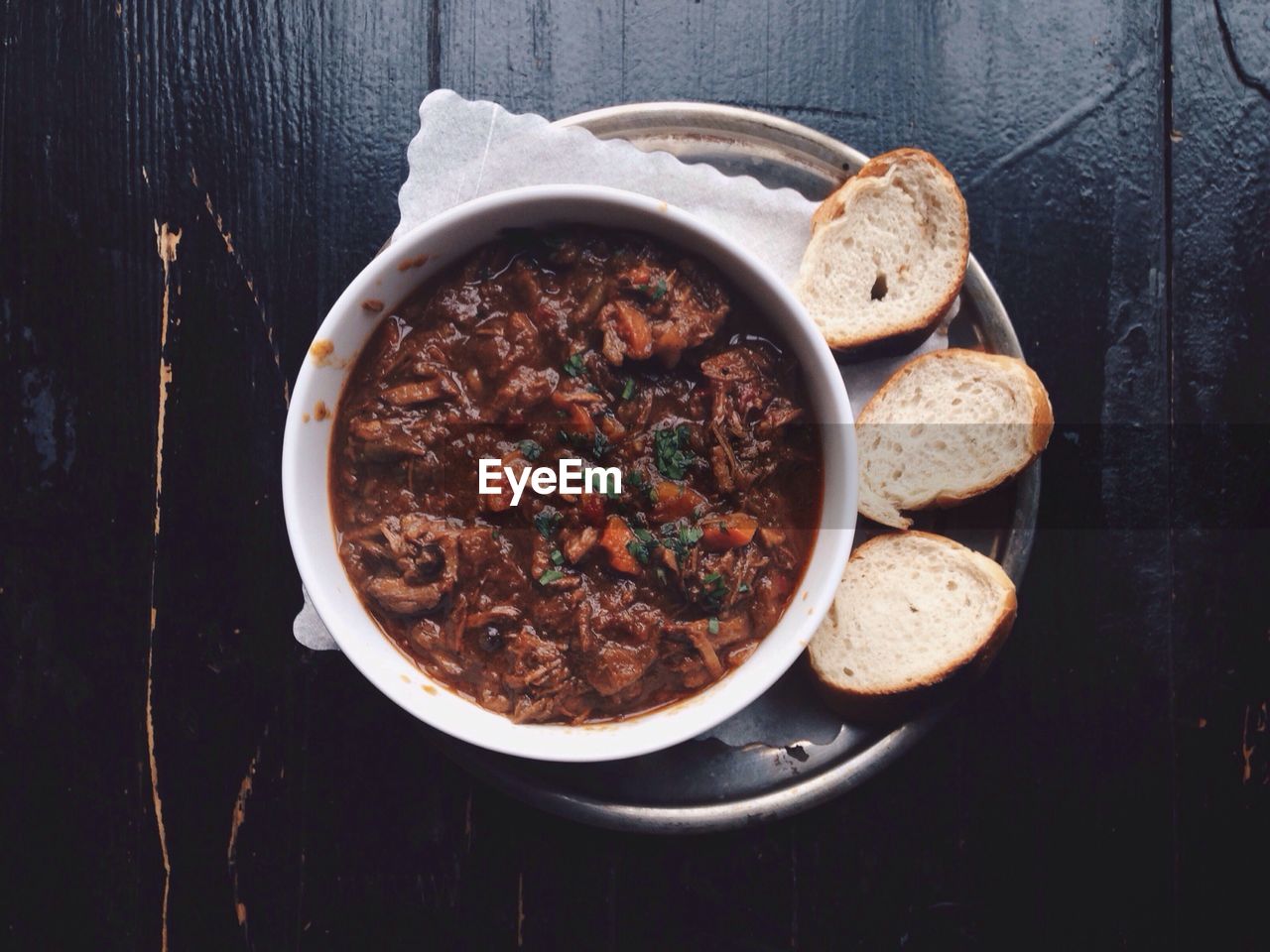 Stew with bread on table