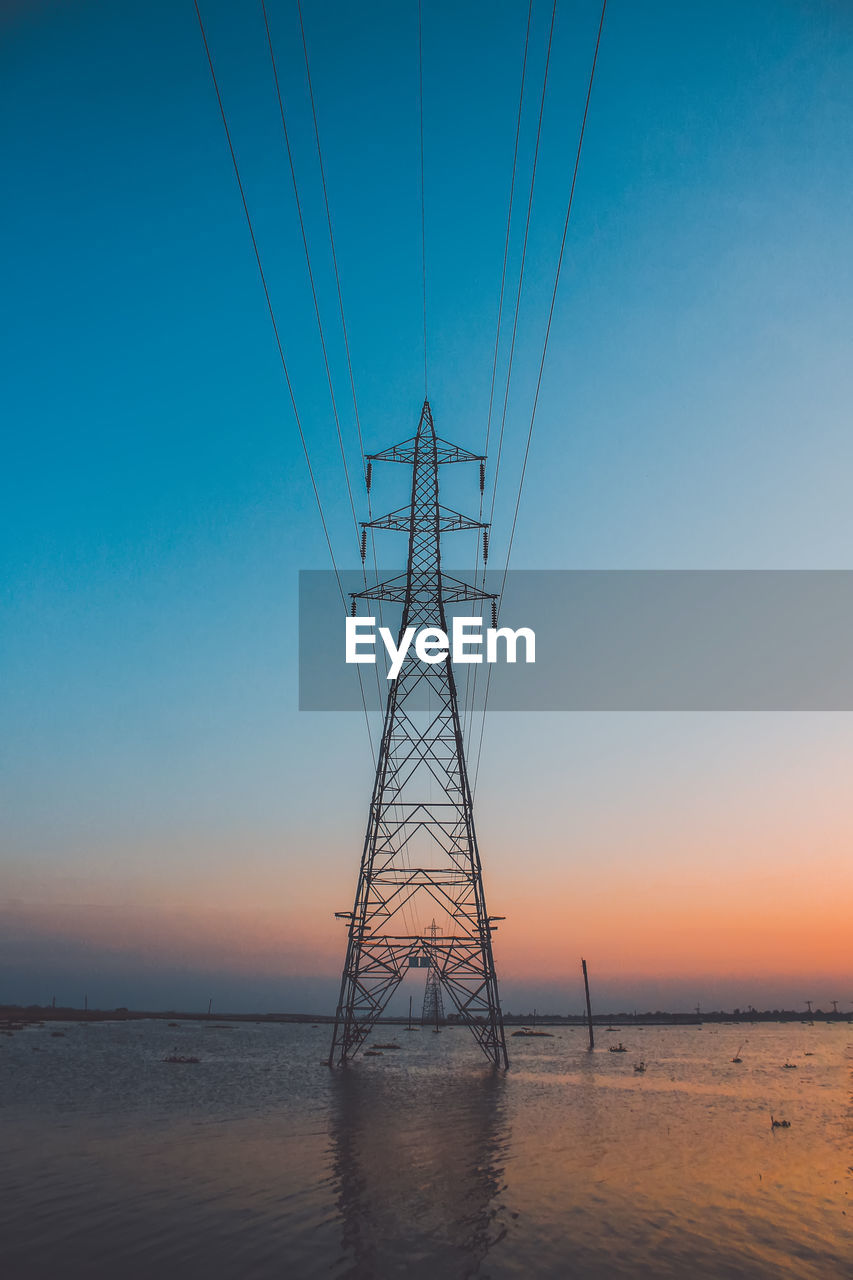 Scenic view of sea against clear sky during sunset