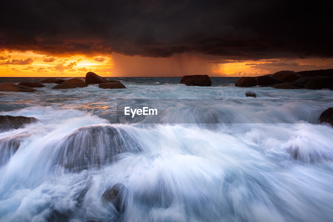 SCENIC VIEW OF SEA DURING SUNSET