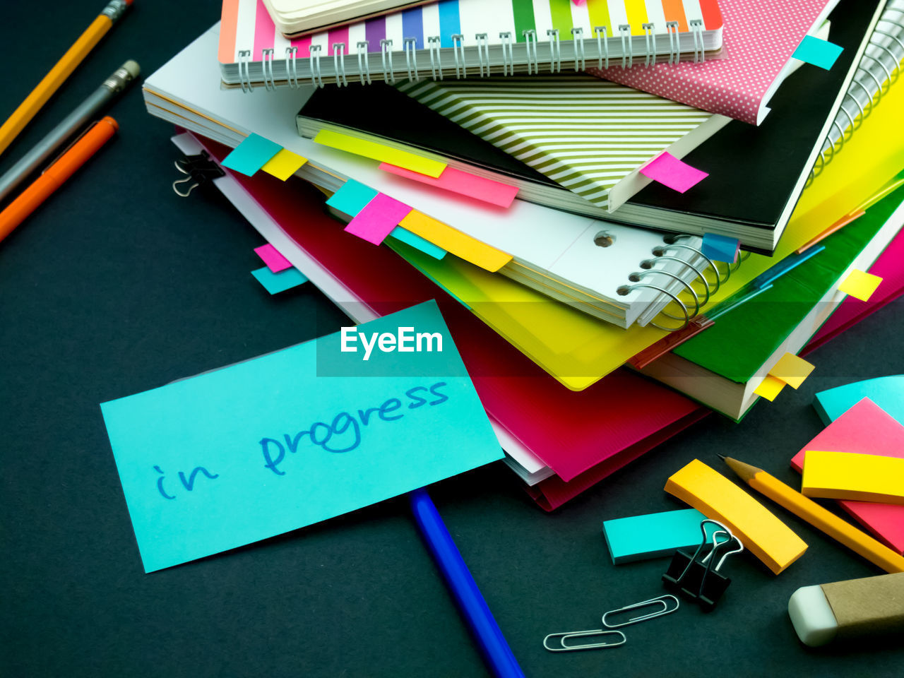 High angle view of text on paper with books at desk