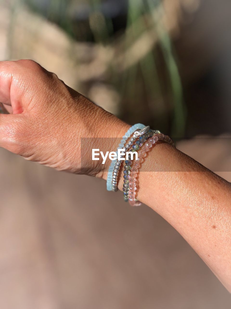 Close-up of hand wearing bracelets