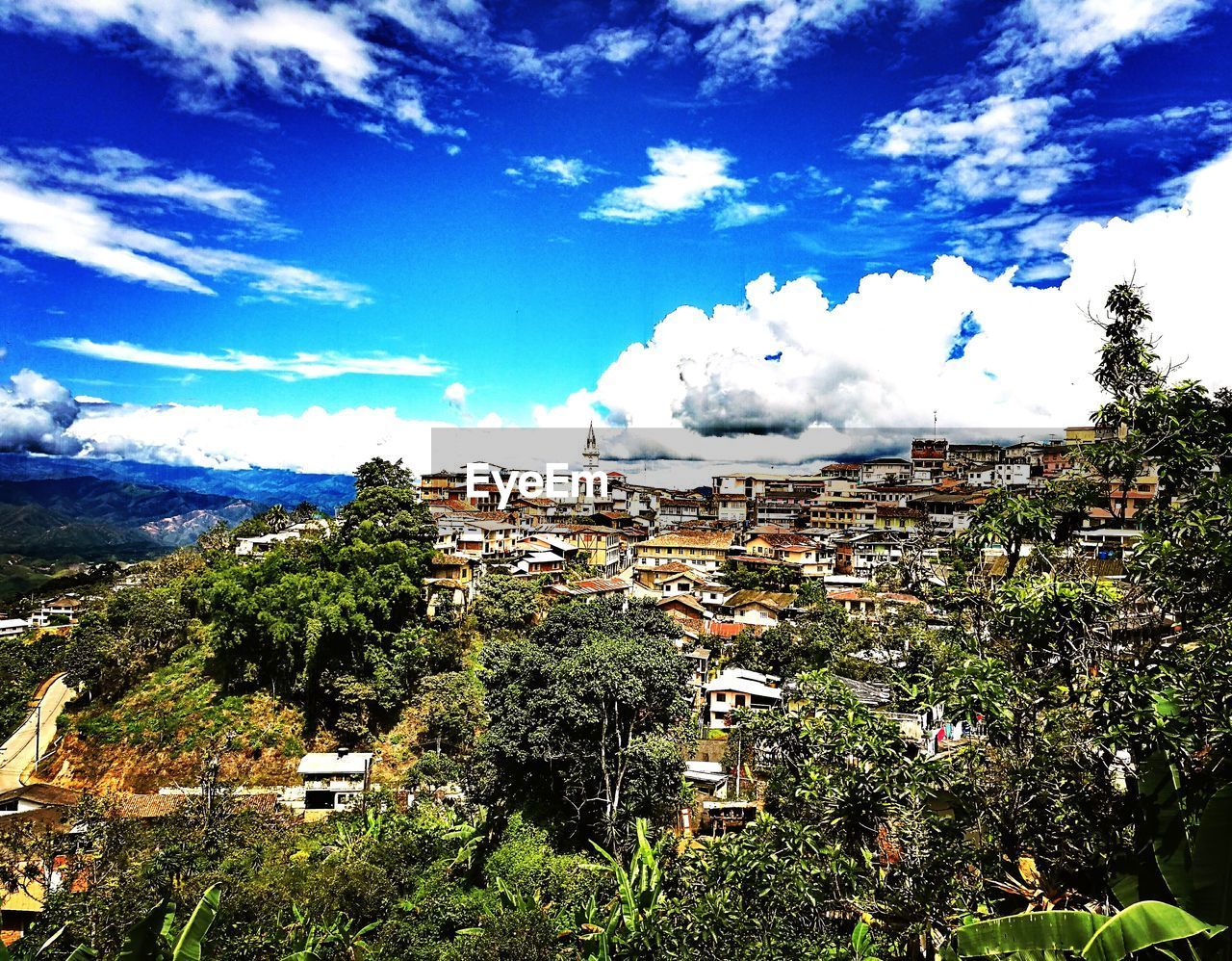 SCENIC VIEW OF LANDSCAPE AND MOUNTAINS AGAINST SKY