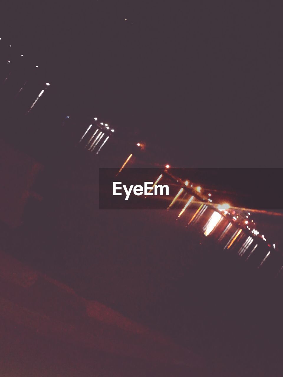 VIEW OF ILLUMINATED LIGHTS AT NIGHT