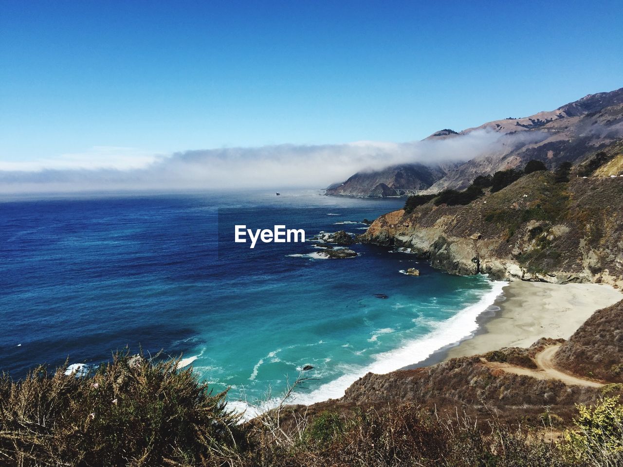 Scenic view of beach and sea against sky