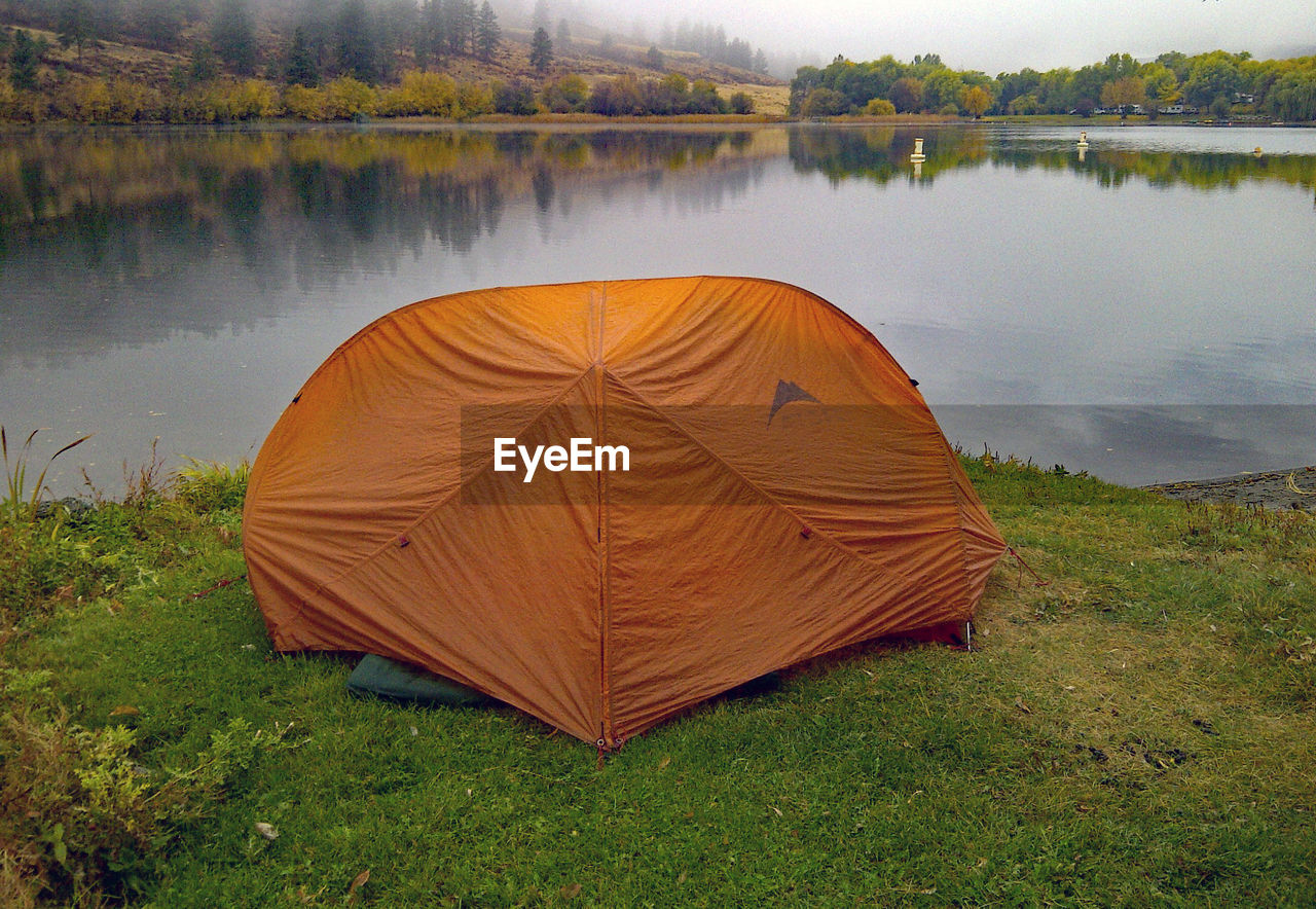 SCENIC VIEW OF TENT ON FIELD