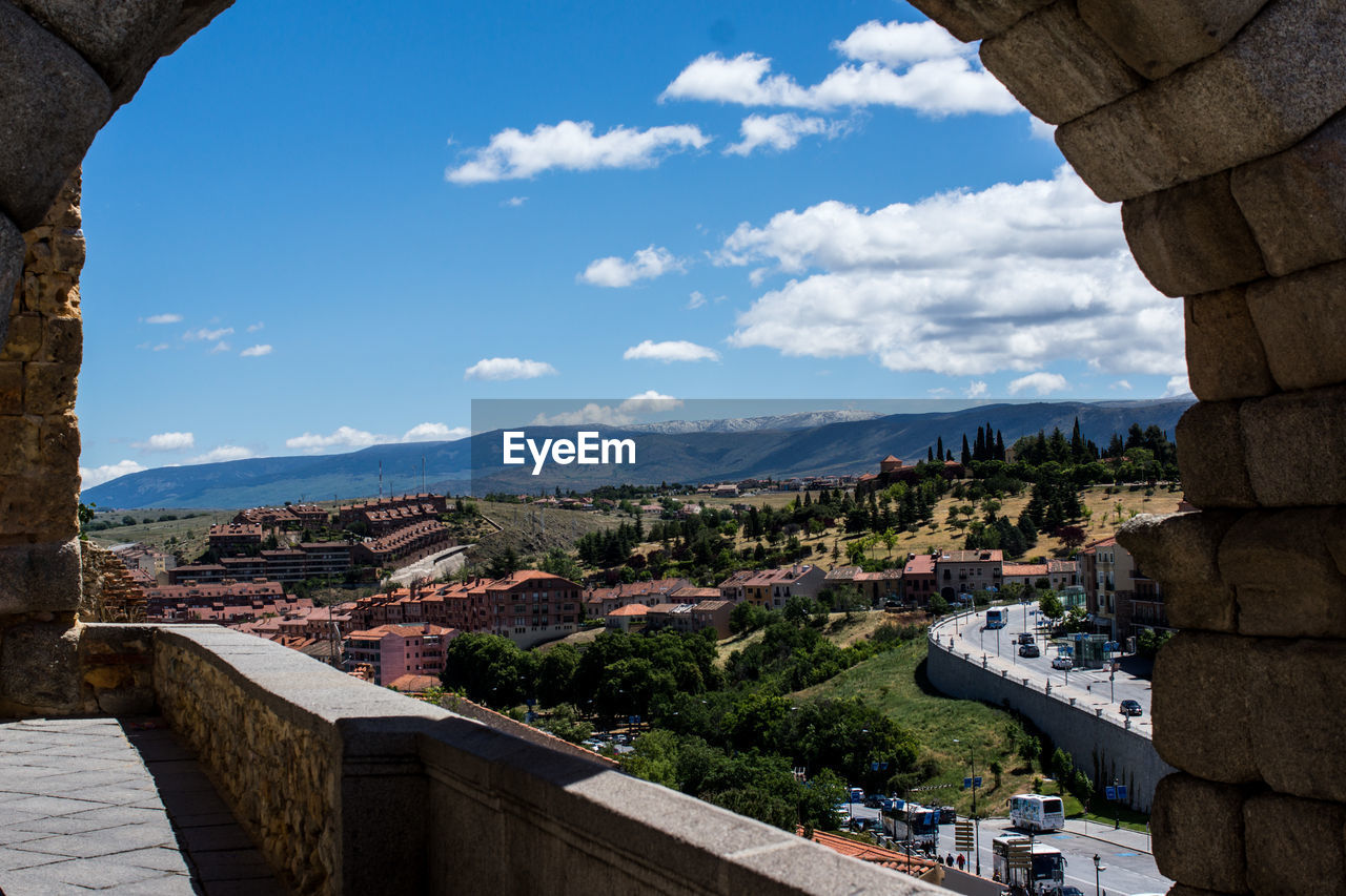 High angle view of city against cloudy sky