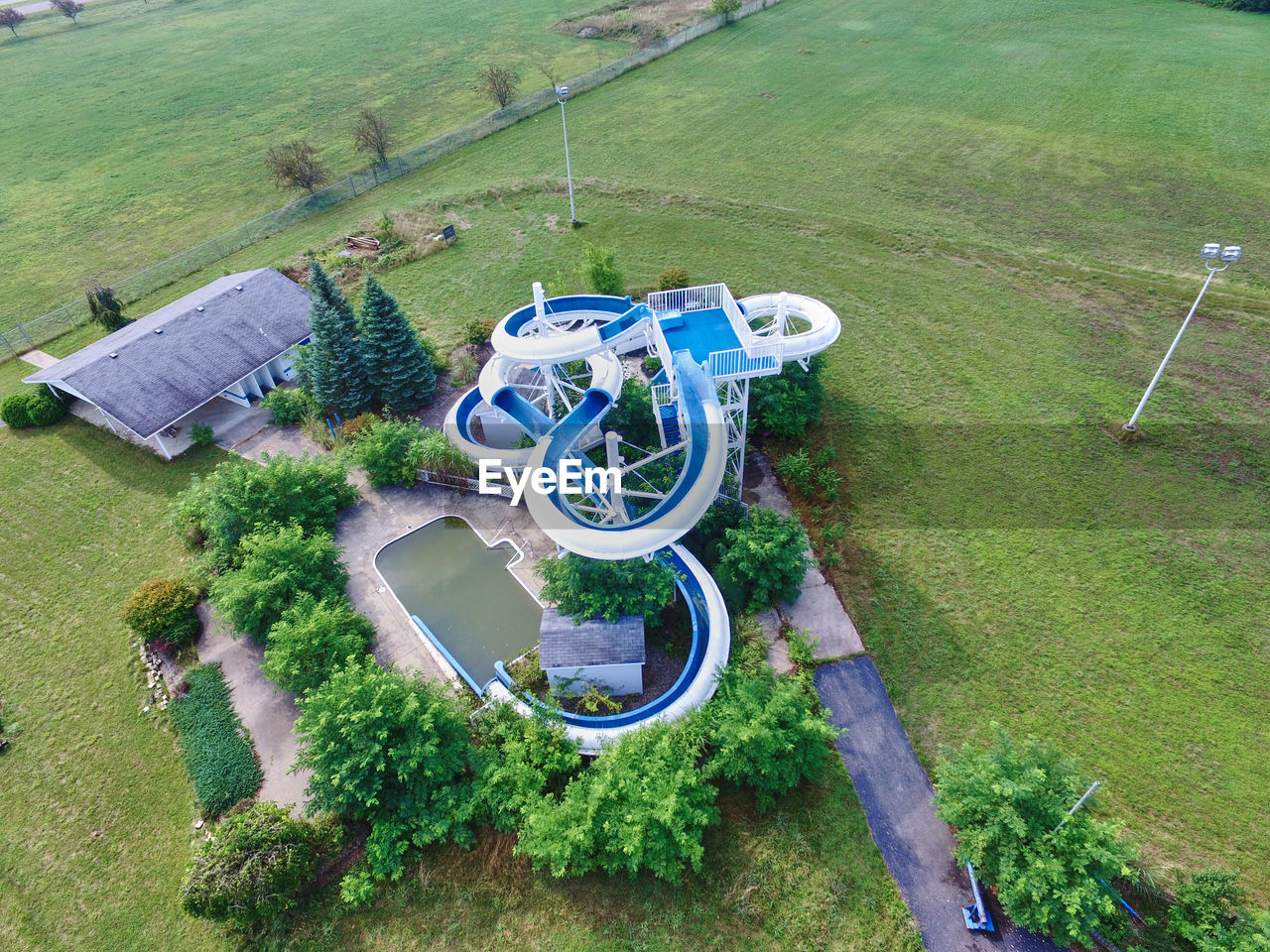 high angle view of people walking on grassy field