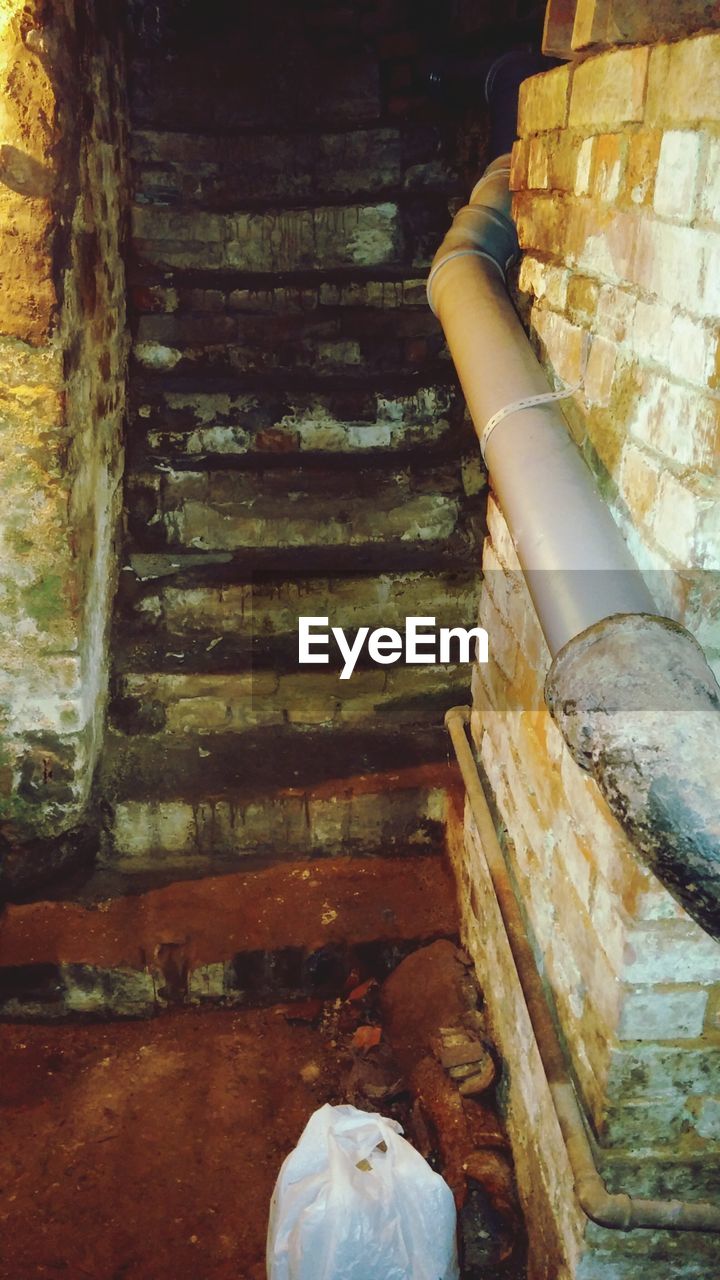 Pipe and steps in old abandoned building