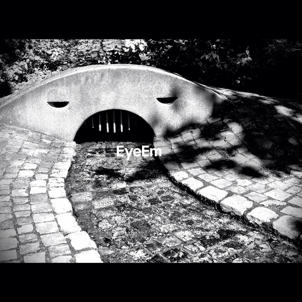 Stone pathway leading to arched structure