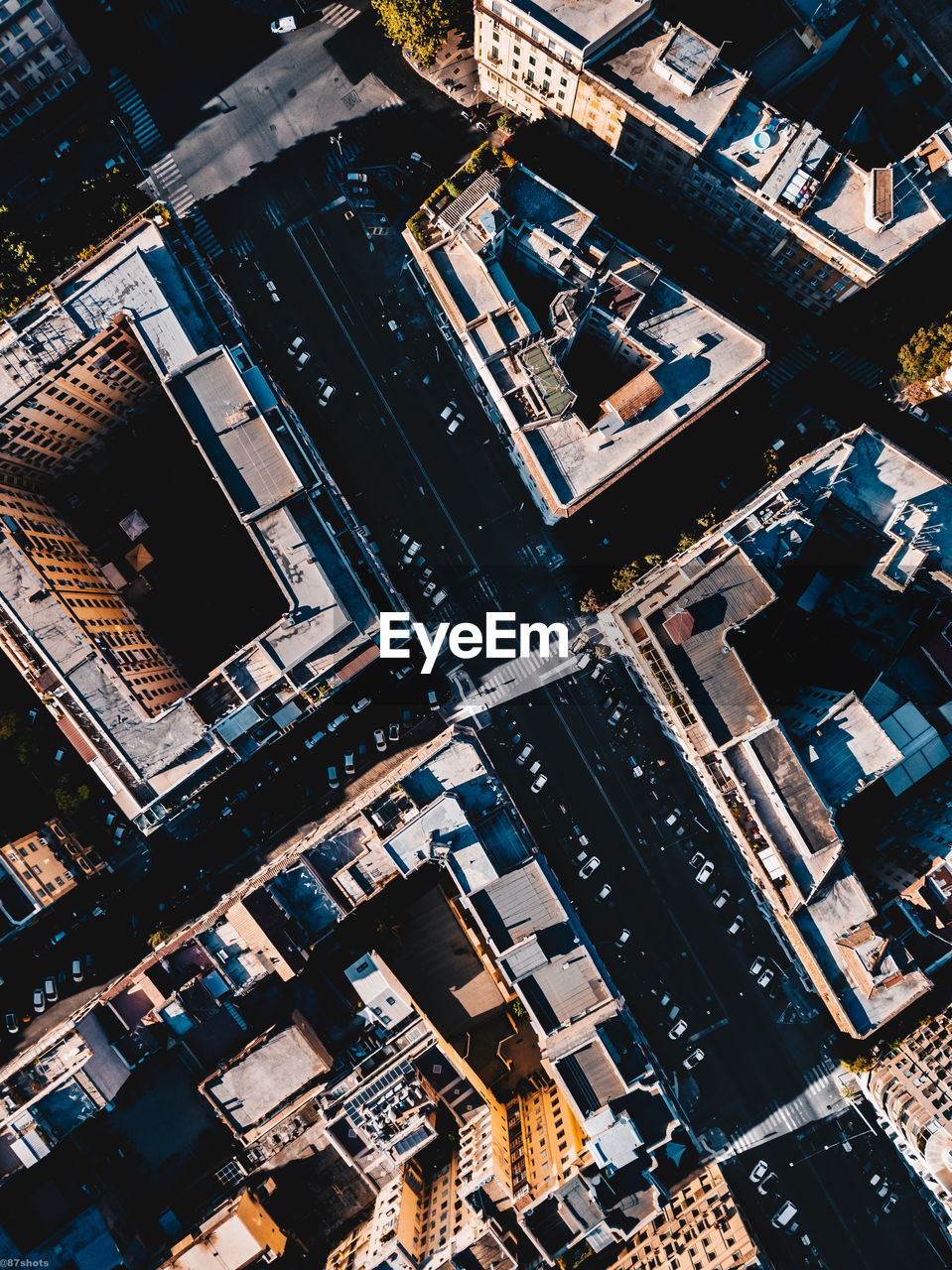 High angle view of illuminated buildings in city during sunrise 