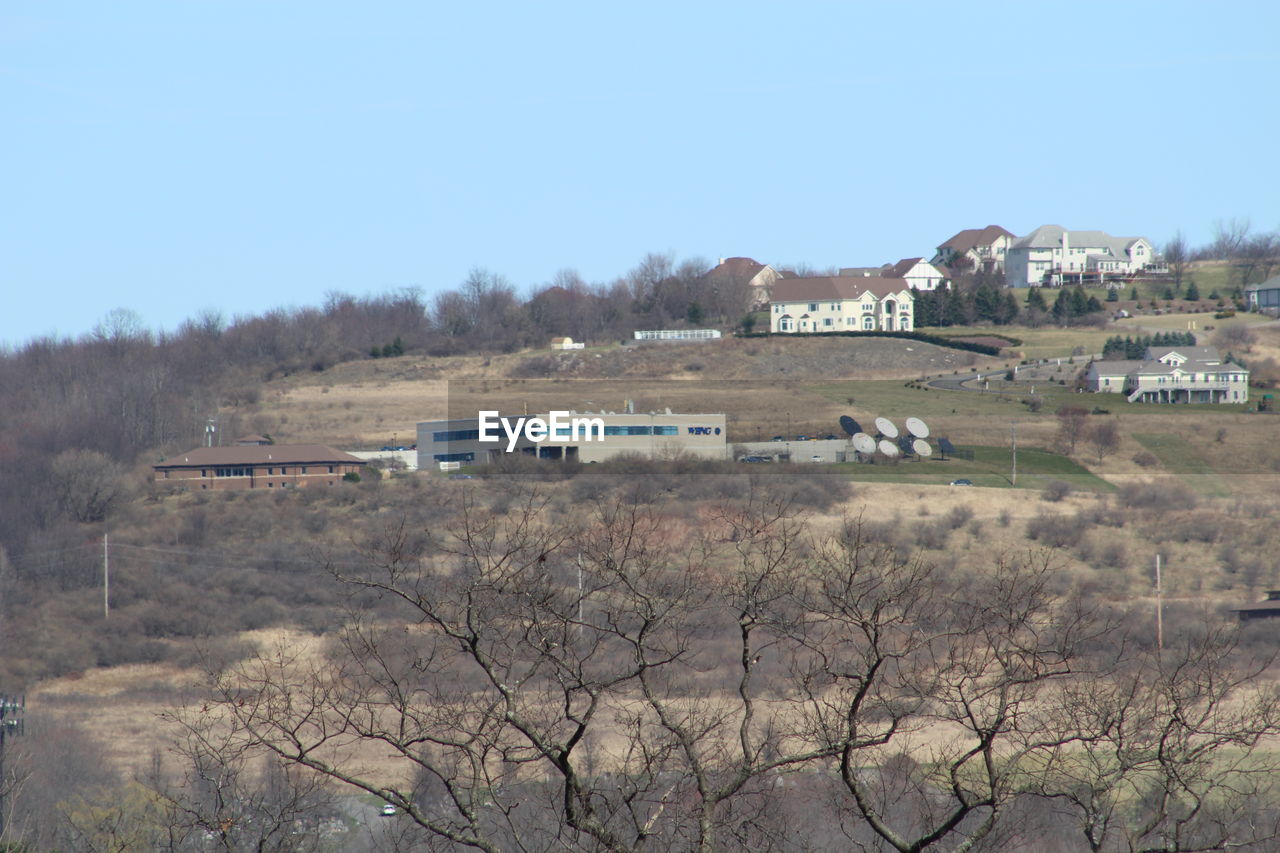 VIEW OF HOUSES ON LANDSCAPE