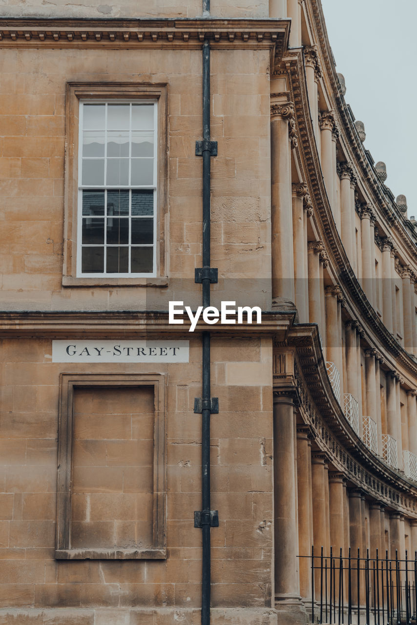 Street name sign on a wall of stone building on gay street in bath, somerset, uk.