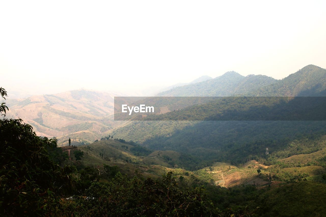 SCENIC VIEW OF MOUNTAINS AGAINST SKY DURING FOGGY WEATHER