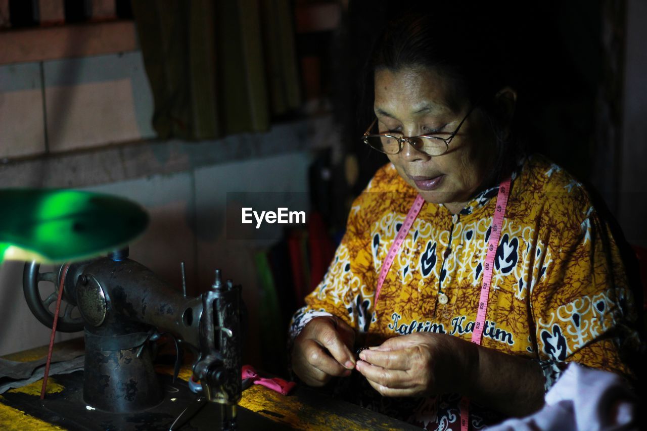 Woman focus on sewing 