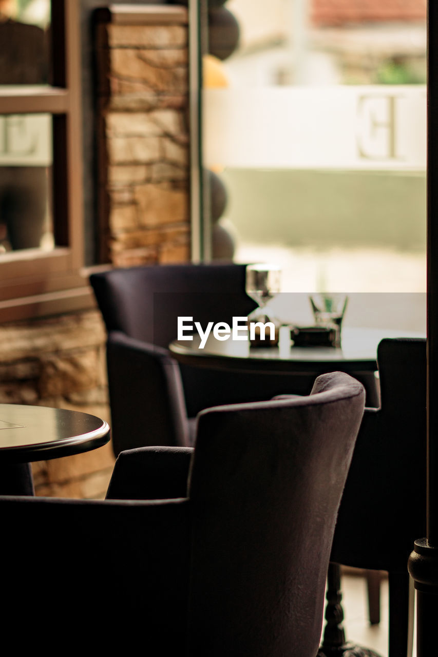 Empty chairs and table in restaurant