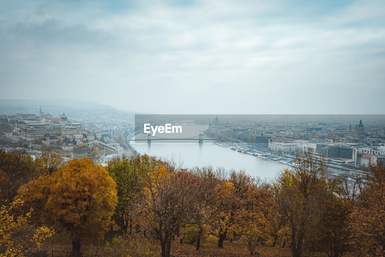 Scenic view of river against sky during autumn