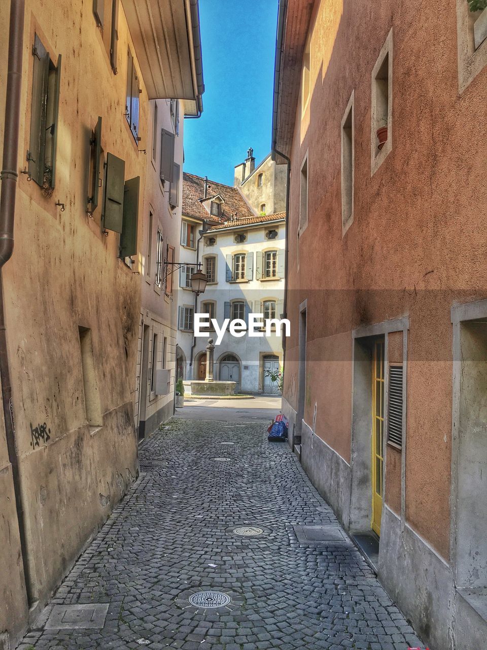 Alley amidst buildings in town