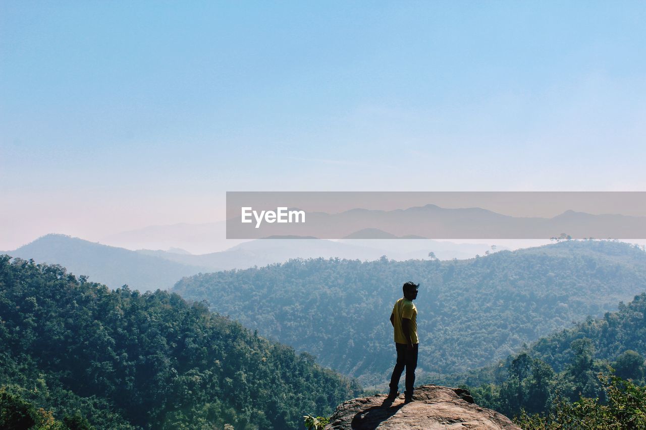 Man looking at mountains 