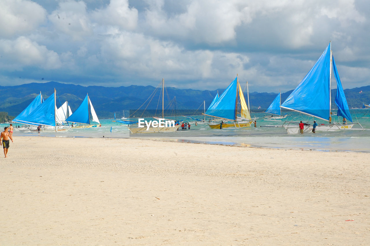 SAILBOATS ON BEACH