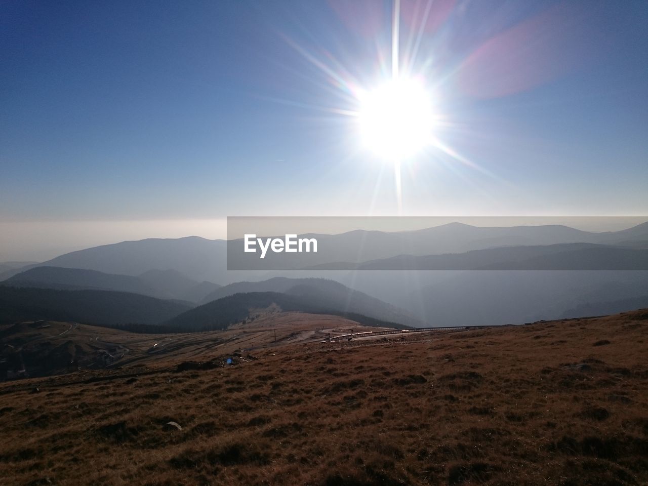 SCENIC VIEW OF MOUNTAINS DURING SUNSET