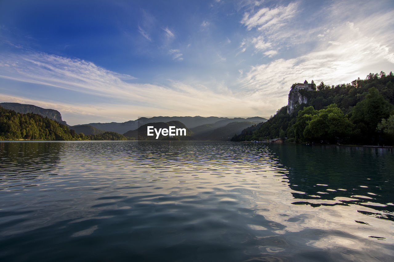 Scenic view of lake against sky during sunset