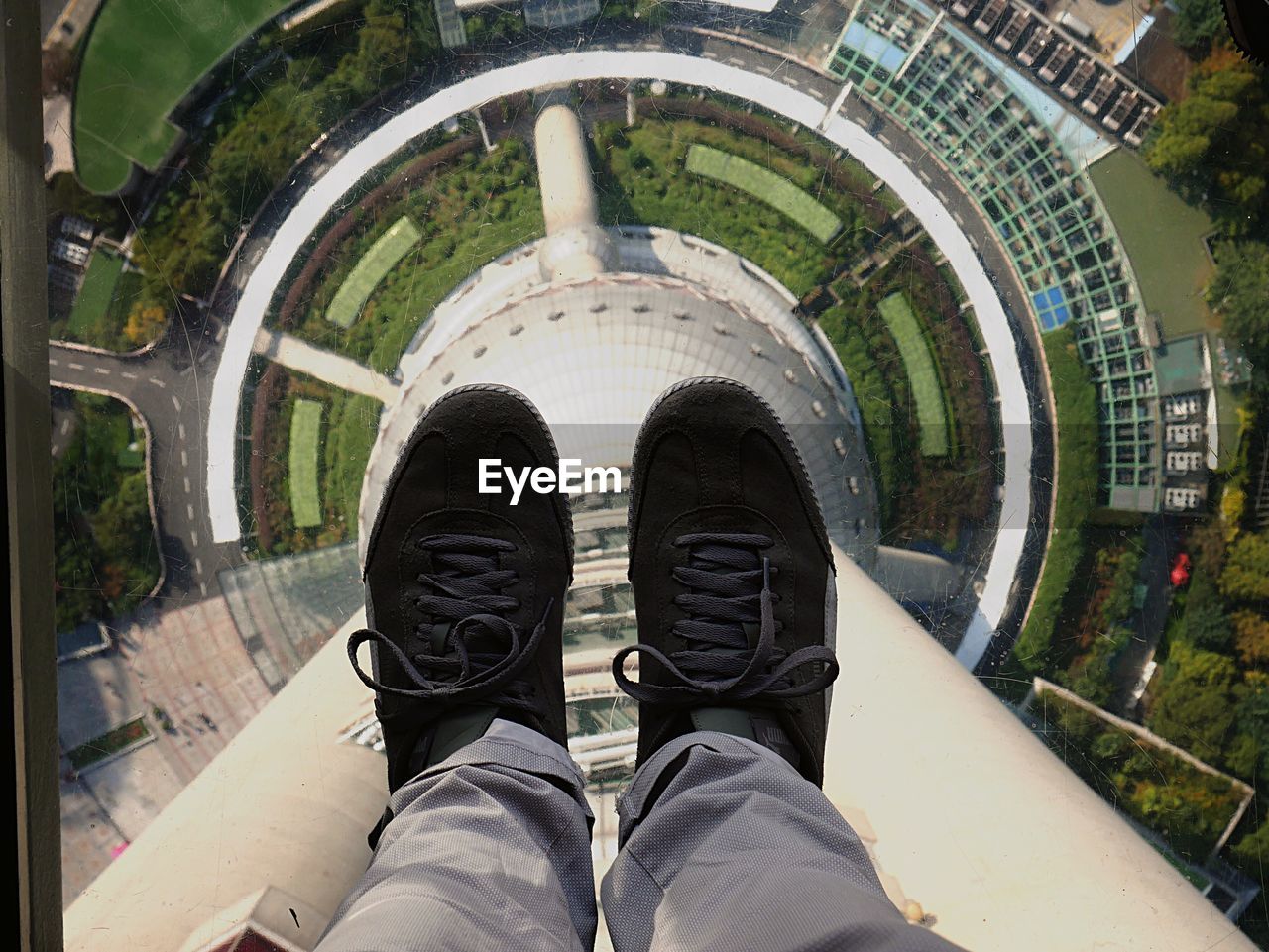 LOW SECTION OF MAN STANDING ON BUILDING