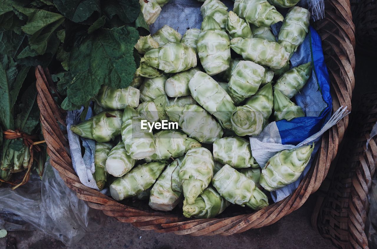 HIGH ANGLE VIEW OF VEGETABLES IN BASKET FOR SALE