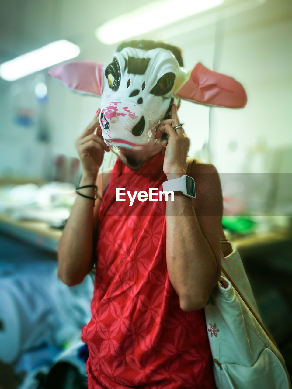 Portrait of person wearing cow mask