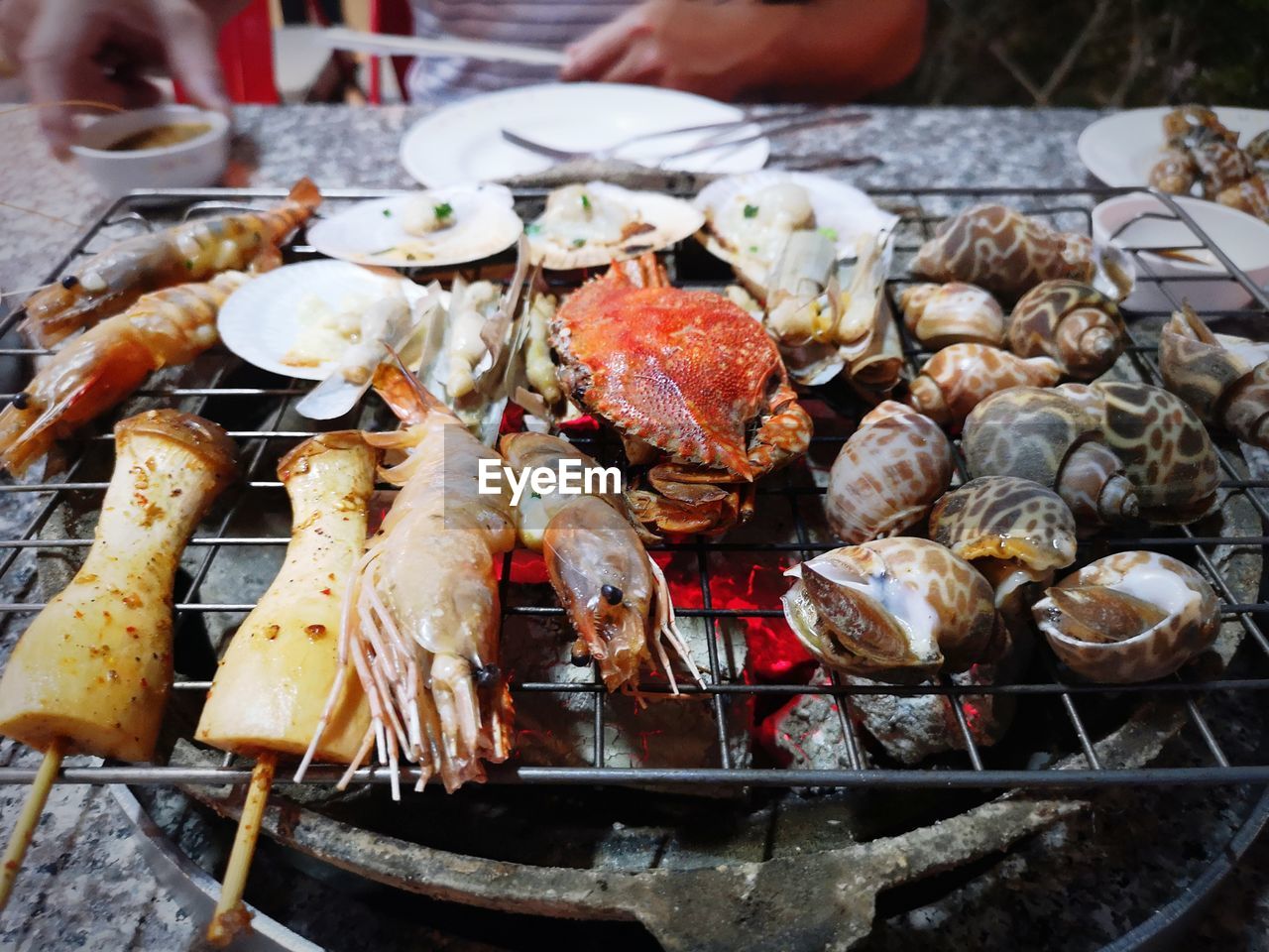 HIGH ANGLE VIEW OF MEAT COOKING ON BARBECUE