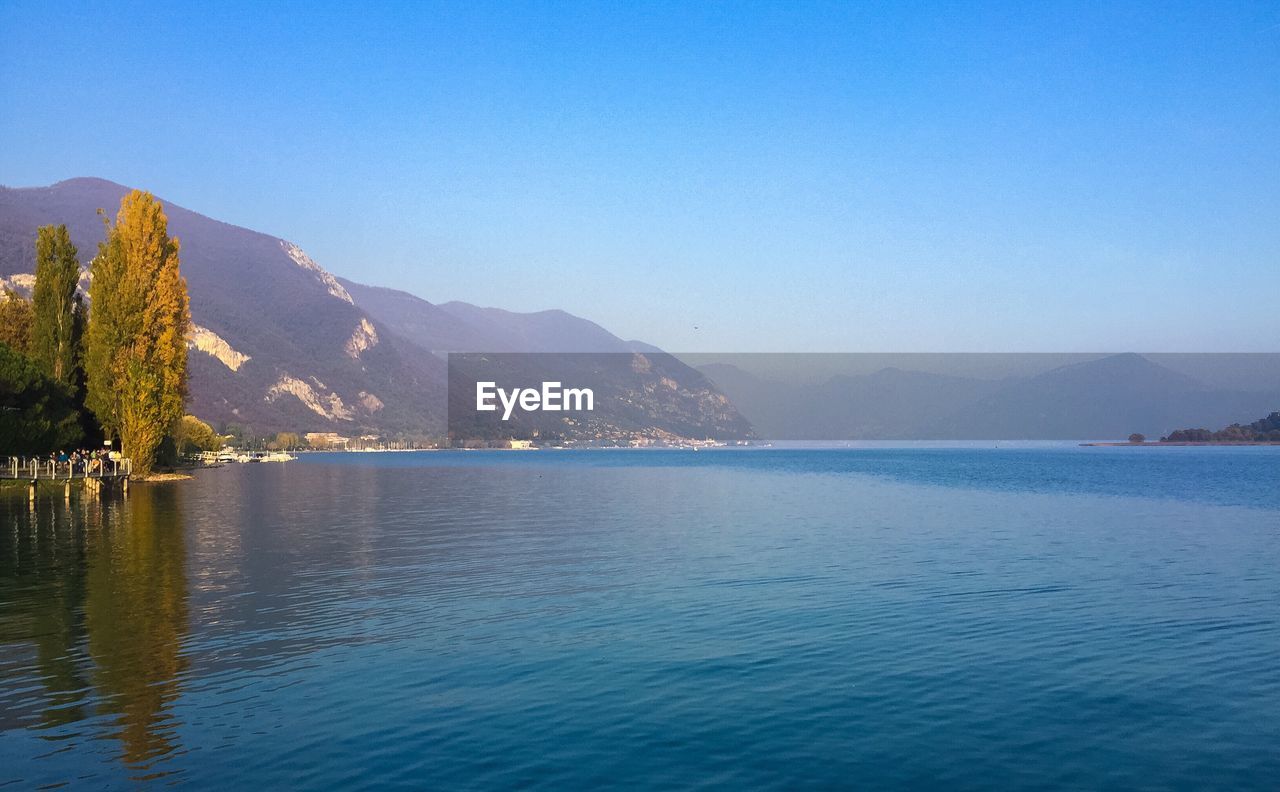 Scenic view of sea against blue sky