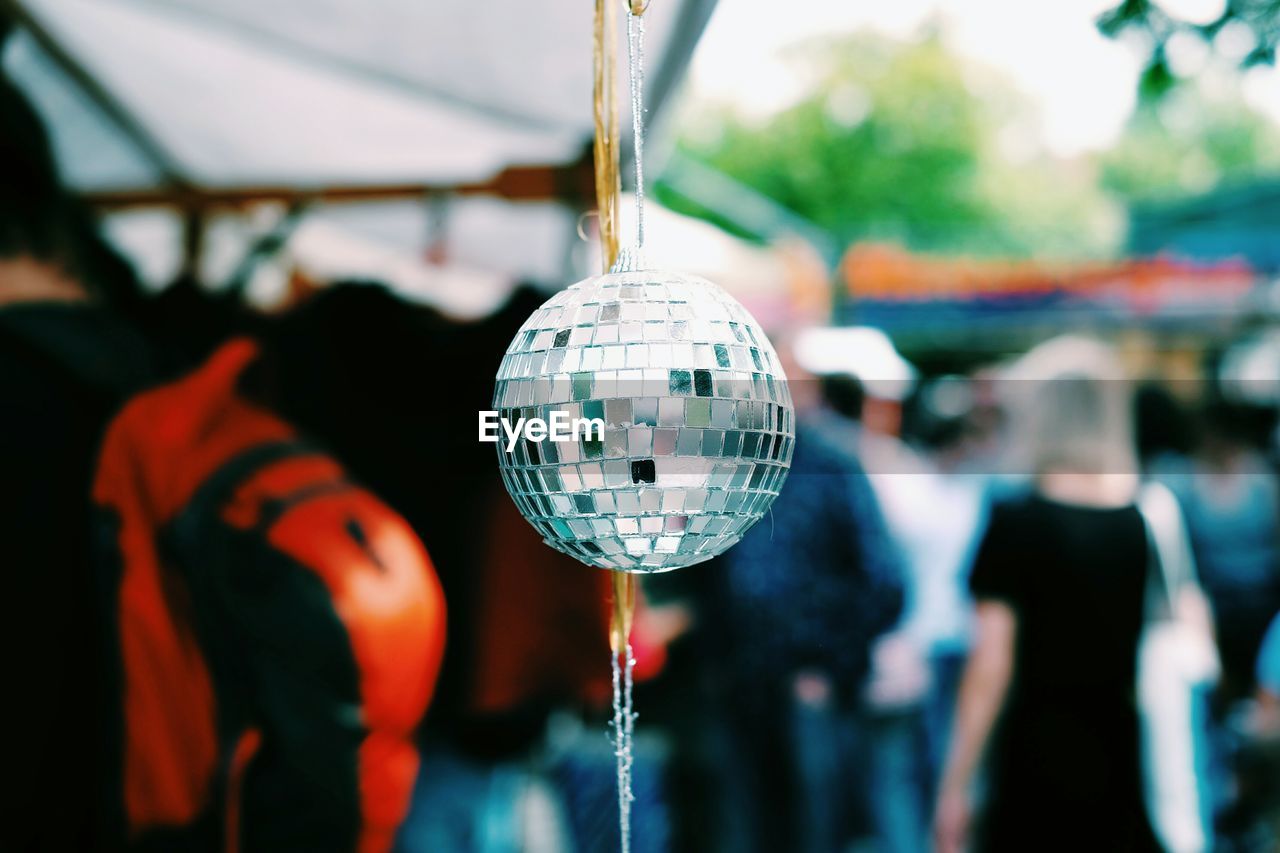 Close-up of disco ball hanging at market stall