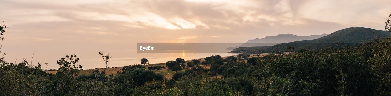 Panoramic view of landscape against sky during sunset