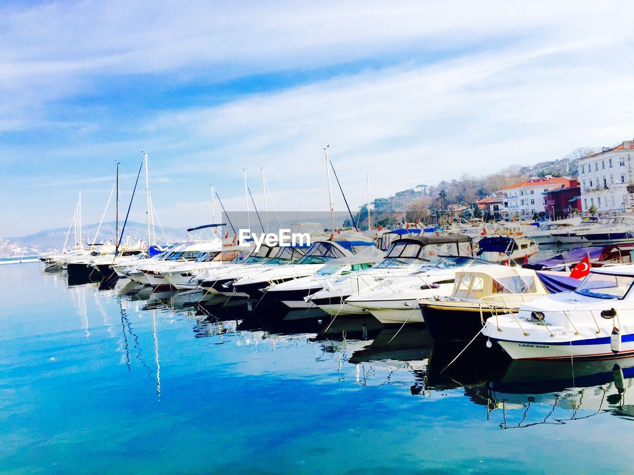 Boats moored at harbor