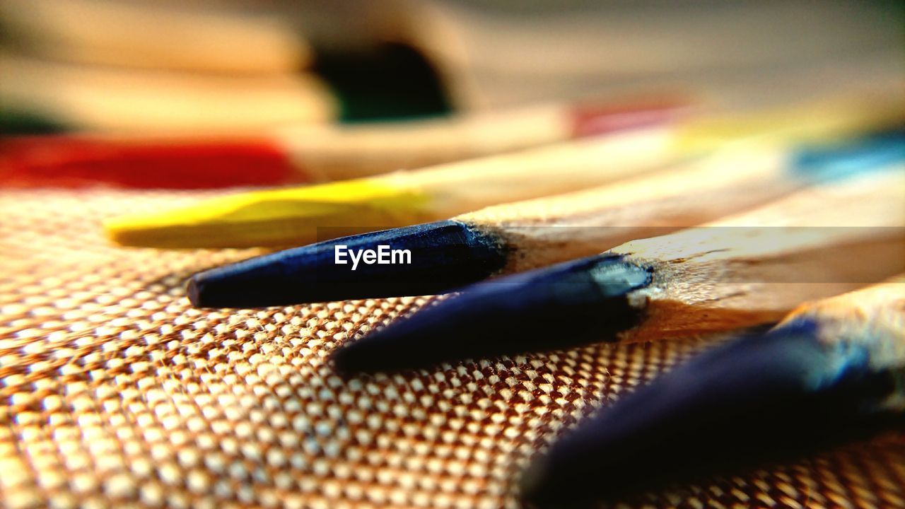 Close-up of colored pencils on table