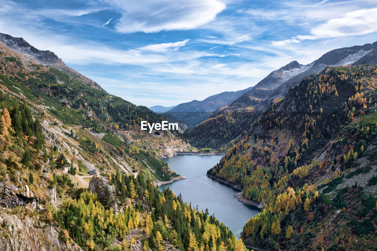 Scenic view of lake by mountains against sky, malta valley austria