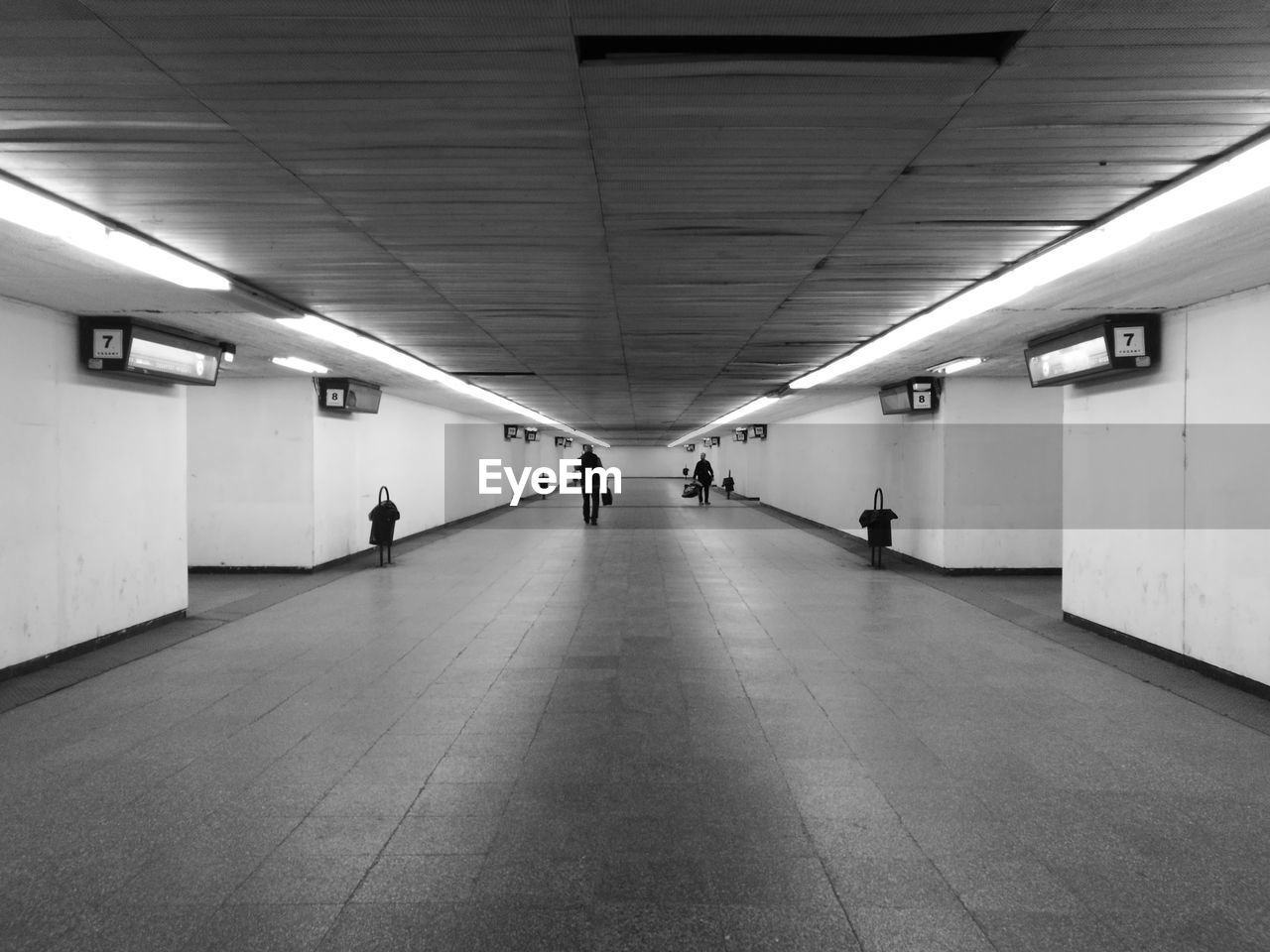 PEOPLE WALKING ON SUBWAY STATION